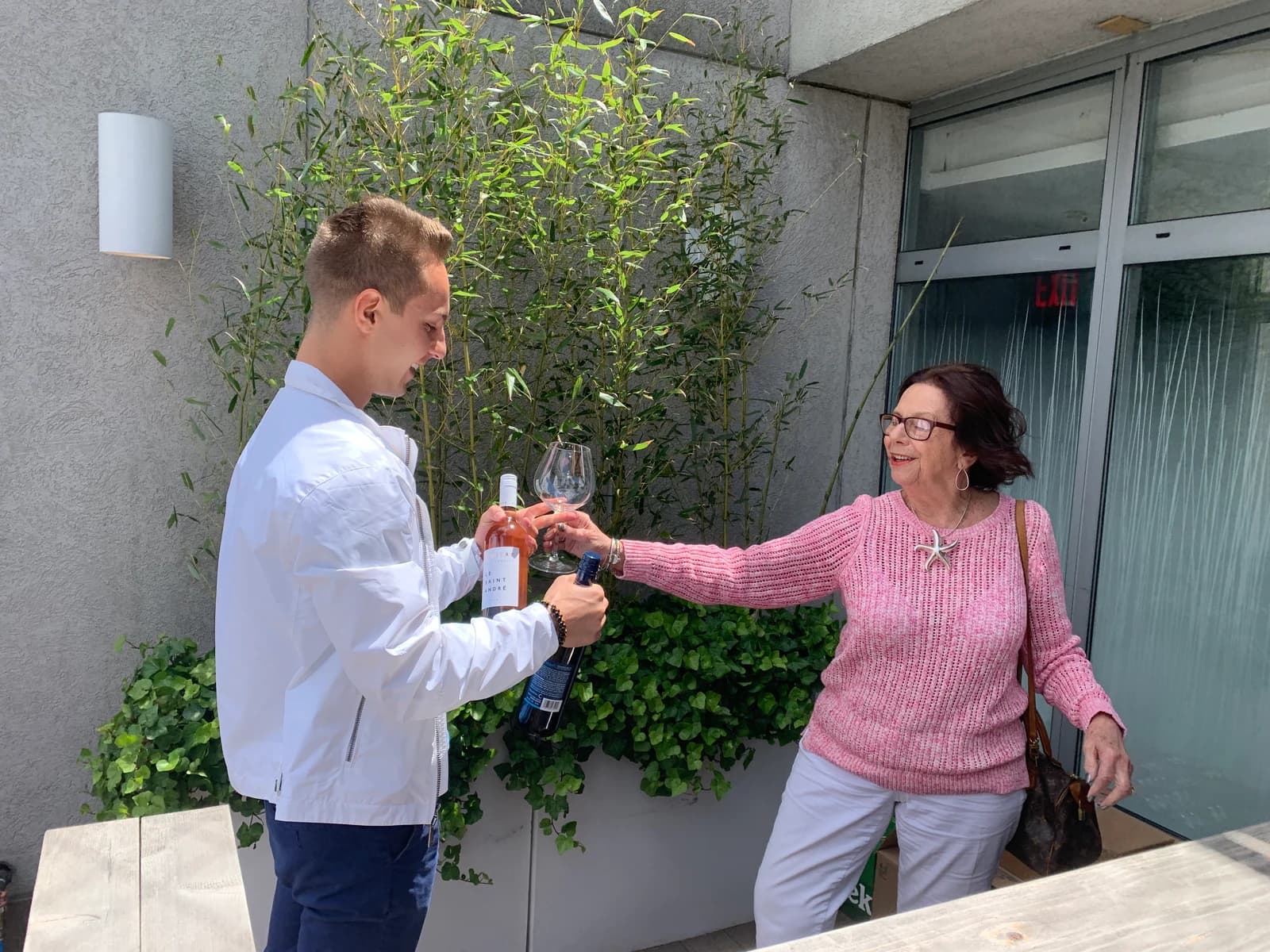 Jordan and his grandmother raising a glass together.